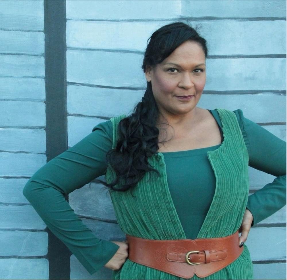 Maya Francine Thomas in green